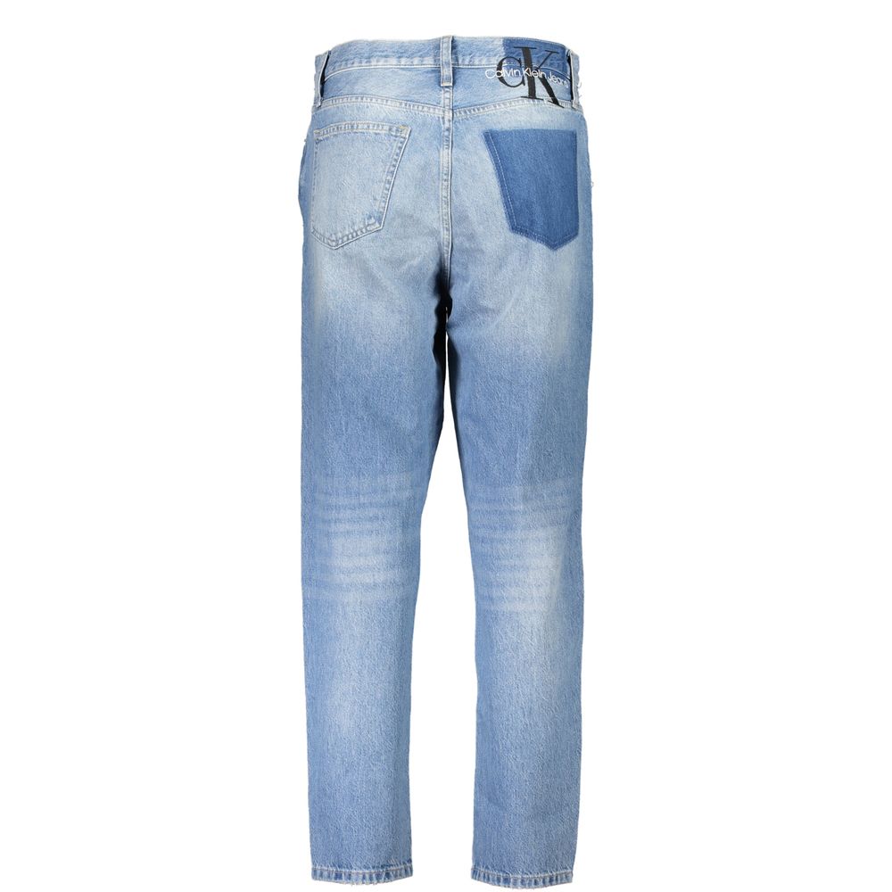 Blue Cotton Women JeansDiscover the quintessence of vintage flair with Calvin Klein’s iconic MOM Jeans. Tailored for the trendsetters, these jeans feature a classic five-pocket design blended with a washed and worn effect that exudes an effortlessly chic