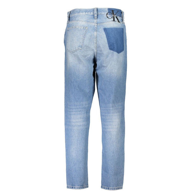 Blue Cotton Women JeansDiscover the quintessence of vintage flair with Calvin Klein’s iconic MOM Jeans. Tailored for the trendsetters, these jeans feature a classic five-pocket design blended with a washed and worn effect that exudes an effortlessly chic