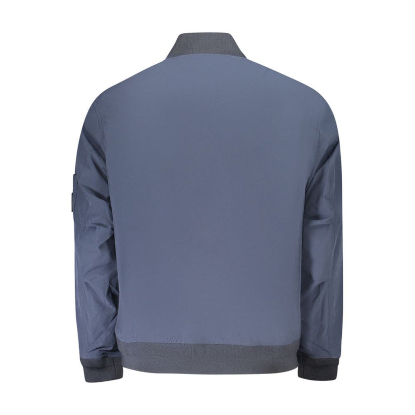 Blue Polyamide Men JacketElevate your wardrobe with the unmistakable sophistication of Hugo Boss. Presenting a versatile blue jacket that defines modern luxury, tailored for the style-conscious individual. Crafted for function and fashion, this piece feat