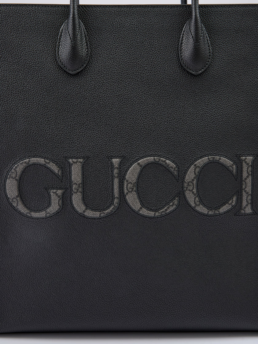Black Leather Logo Medium Tote BagGUCCI Gorgeous brand new, 100% Authentic Gucci women’s Black Leather Logo Medium Tote Bag. Model: Tote Bag Color: Black Material: 100% Leather 120cm removable and adjustable shoulder strap. One internal compartment with o