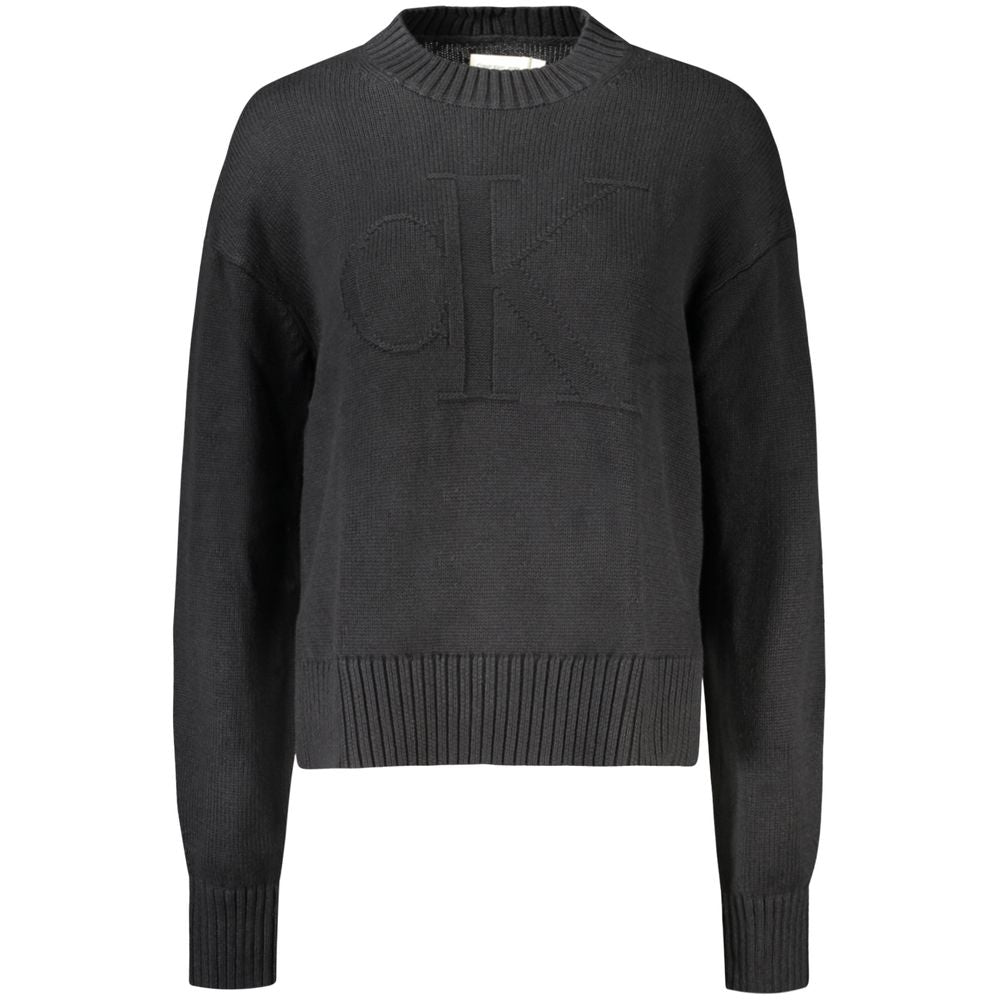 Black Cotton Women SweaterElevate your wardrobe with the quintessence of sophistication – the Calvin Klein Long-Sleeved Sweater. Crafted from a premium blend of cotton and wool, this high neck gem offers comfort with a dash of luxury. Featuring an elegant