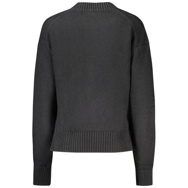 Black Cotton Women SweaterElevate your wardrobe with the quintessence of sophistication – the Calvin Klein Long-Sleeved Sweater. Crafted from a premium blend of cotton and wool, this high neck gem offers comfort with a dash of luxury. Featuring an elegant