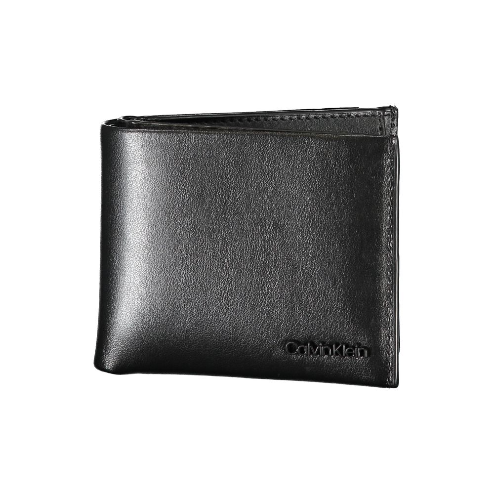 Elegant Black Leather Dual-Compartment WalletStep up your accessory game with this sophisticated wallet, perfect for the modern man with a taste for classic style and utility. Crafted by the esteemed Calvin Klein, this wallet boasts two separate compartme