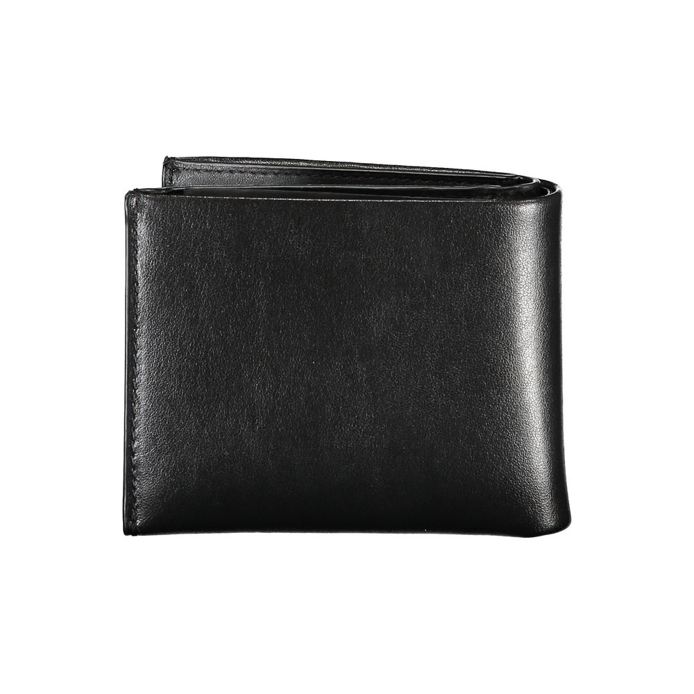 Elegant Black Leather Dual-Compartment WalletStep up your accessory game with this sophisticated wallet, perfect for the modern man with a taste for classic style and utility. Crafted by the esteemed Calvin Klein, this wallet boasts two separate compartme