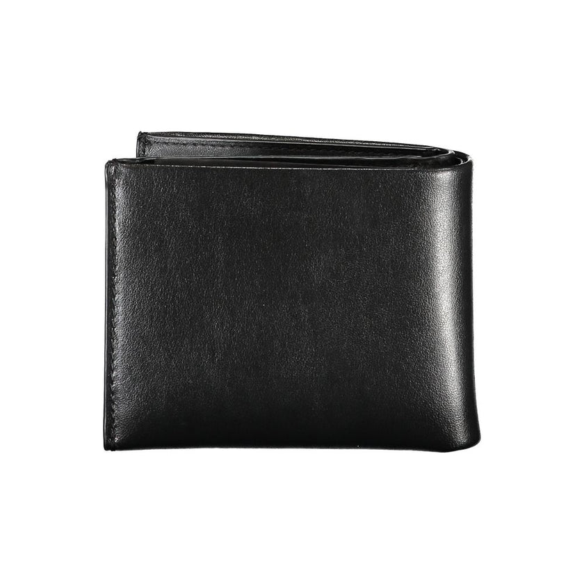 Elegant Black Leather Dual-Compartment WalletStep up your accessory game with this sophisticated wallet, perfect for the modern man with a taste for classic style and utility. Crafted by the esteemed Calvin Klein, this wallet boasts two separate compartme