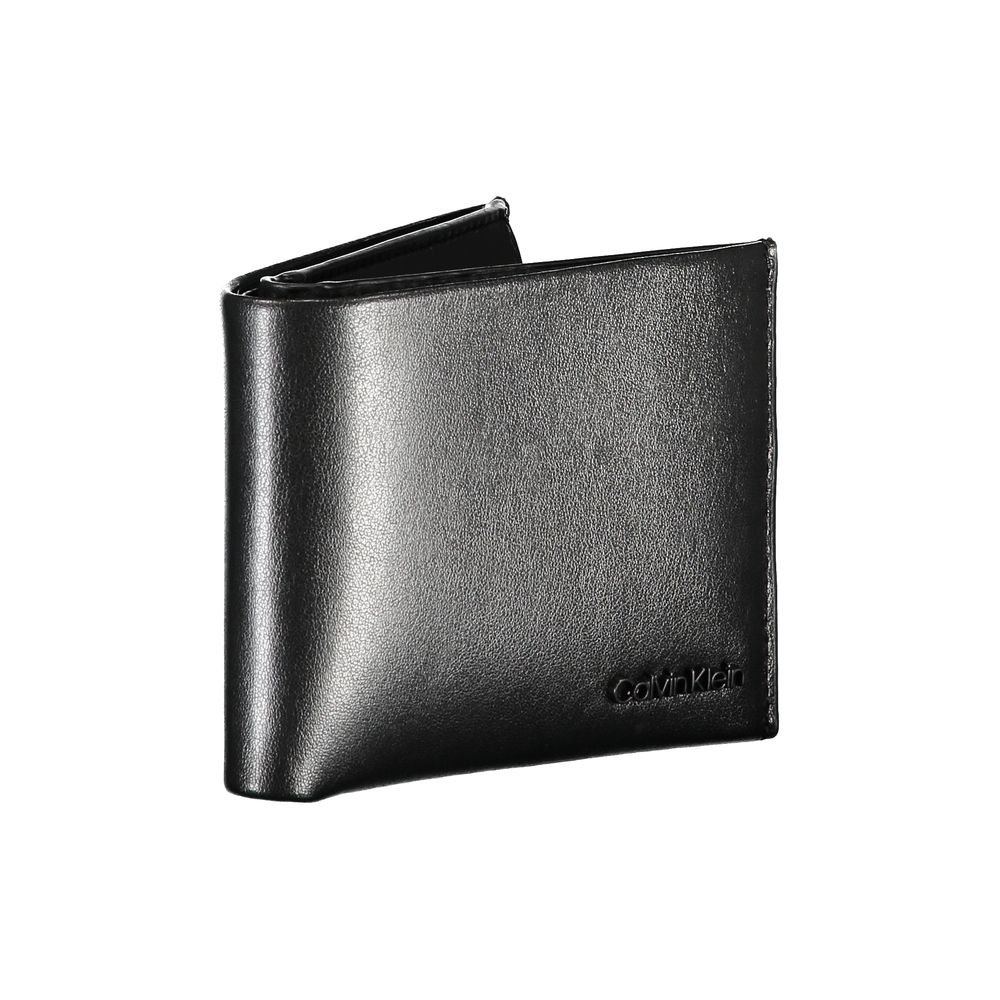 Elegant Black Leather Dual-Compartment WalletStep up your accessory game with this sophisticated wallet, perfect for the modern man with a taste for classic style and utility. Crafted by the esteemed Calvin Klein, this wallet boasts two separate compartme