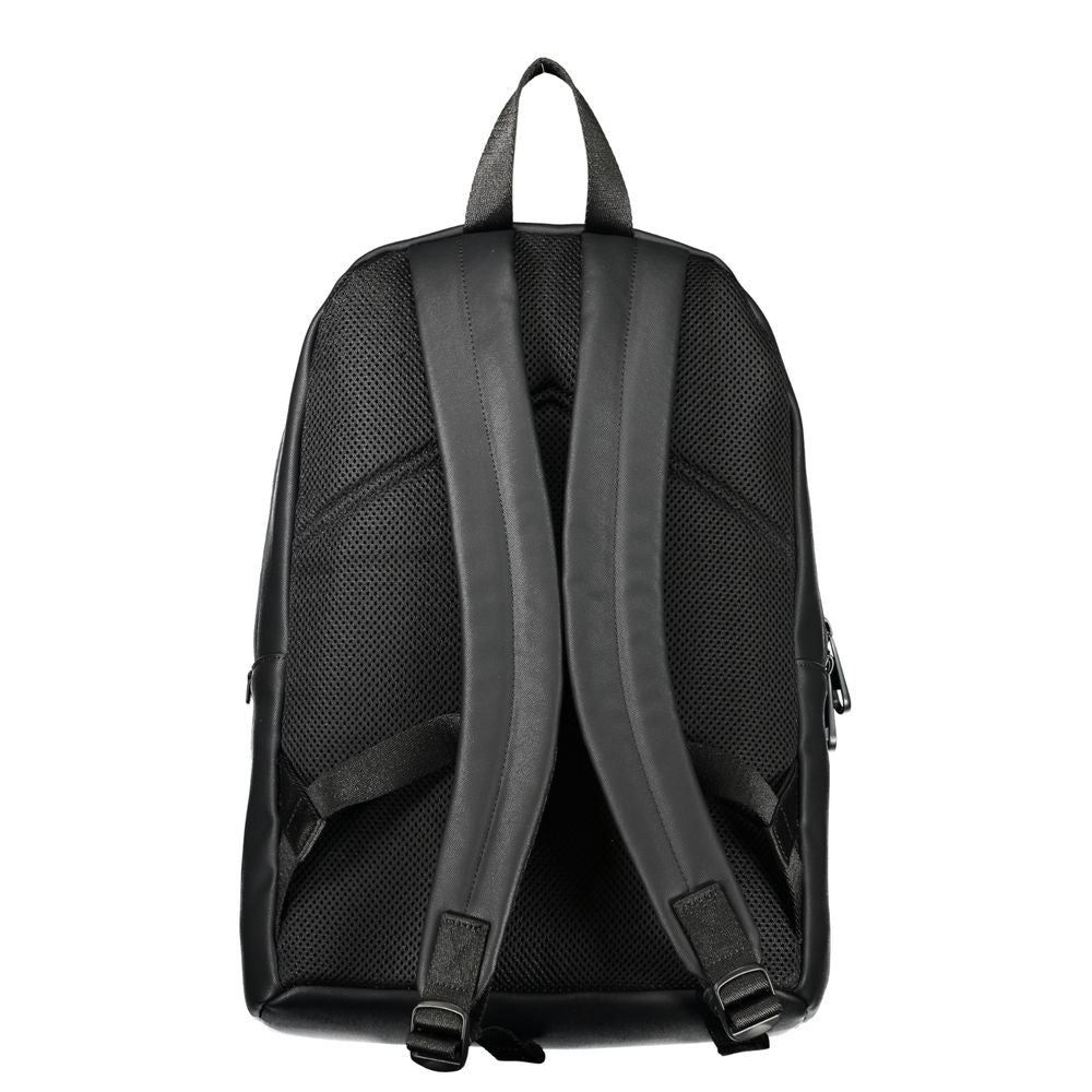 Elegant Urban Backpack with Laptop CompartmentExperience functionality meeting style with this sleek Calvin Klein backpack. Designed for the modern urbanite, it comes equipped with a dedicated laptop compartment, pen holder spaces, and an easily accessibl