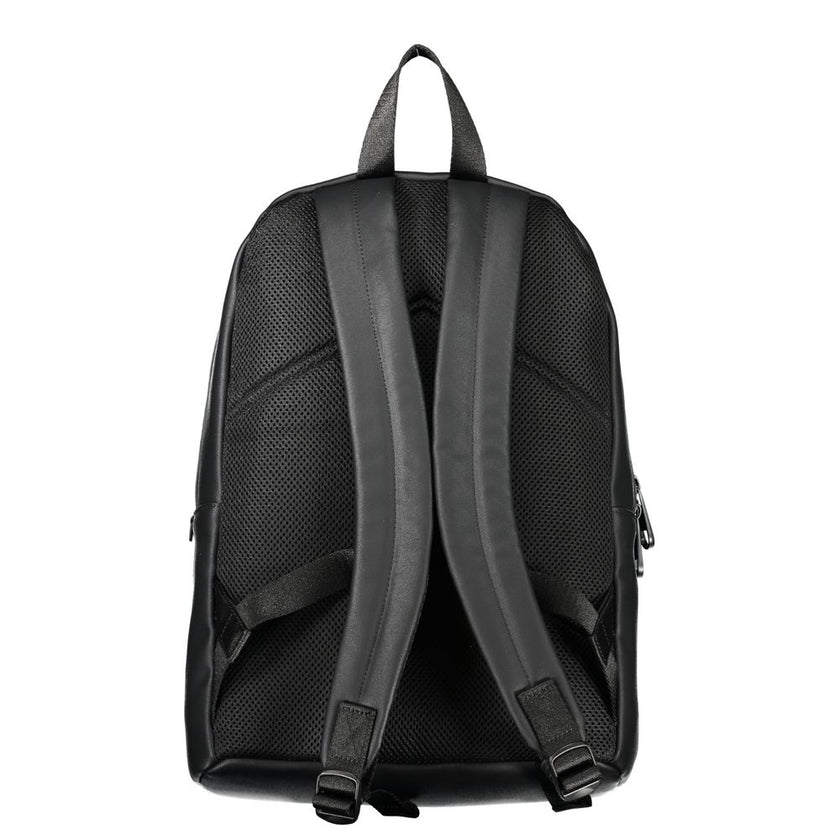 Elegant Urban Backpack with Laptop CompartmentExperience functionality meeting style with this sleek Calvin Klein backpack. Designed for the modern urbanite, it comes equipped with a dedicated laptop compartment, pen holder spaces, and an easily accessibl