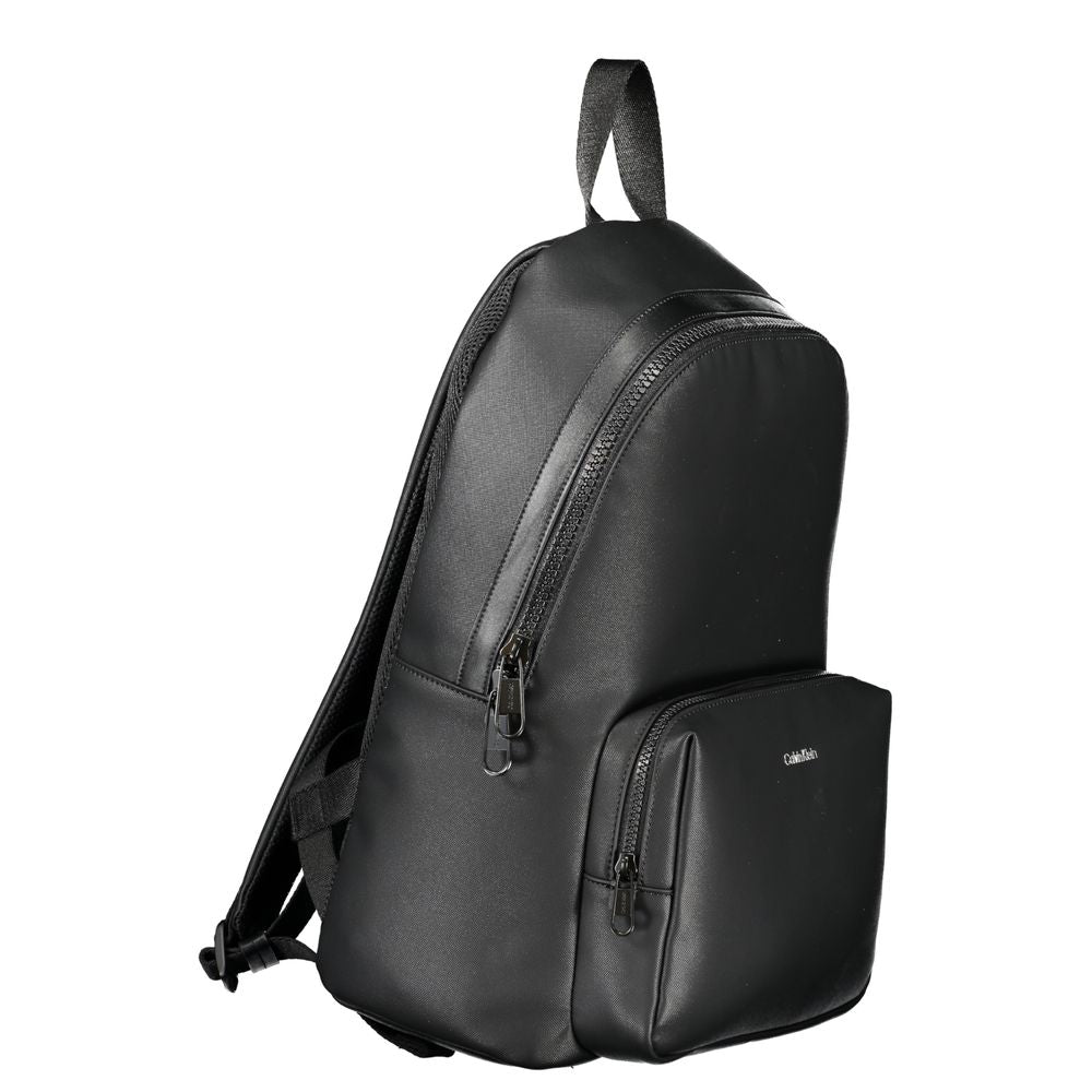 Elegant Urban Backpack with Laptop CompartmentExperience functionality meeting style with this sleek Calvin Klein backpack. Designed for the modern urbanite, it comes equipped with a dedicated laptop compartment, pen holder spaces, and an easily accessibl