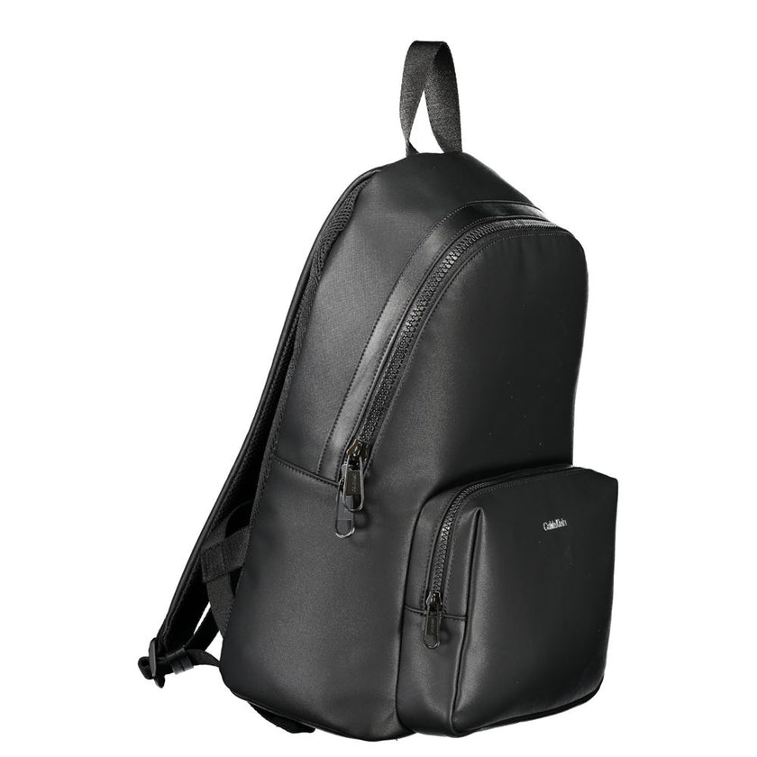 Elegant Urban Backpack with Laptop CompartmentExperience functionality meeting style with this sleek Calvin Klein backpack. Designed for the modern urbanite, it comes equipped with a dedicated laptop compartment, pen holder spaces, and an easily accessibl