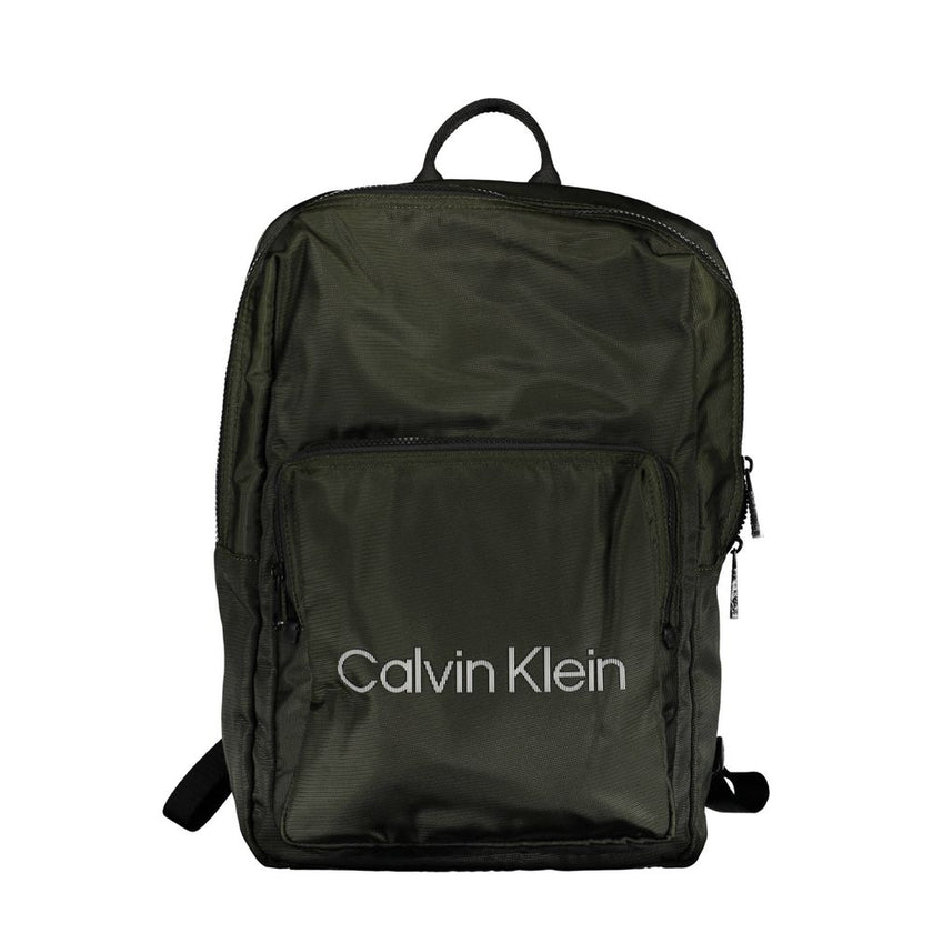 Green Polyester Men BackpackStep into the urban jungle with Calvin Klein’s sleek backpack, crafted for the modern voyager. Merging style with functionality, this green accessory boasts an external pocket for easy access, an internal laptop space to keep y