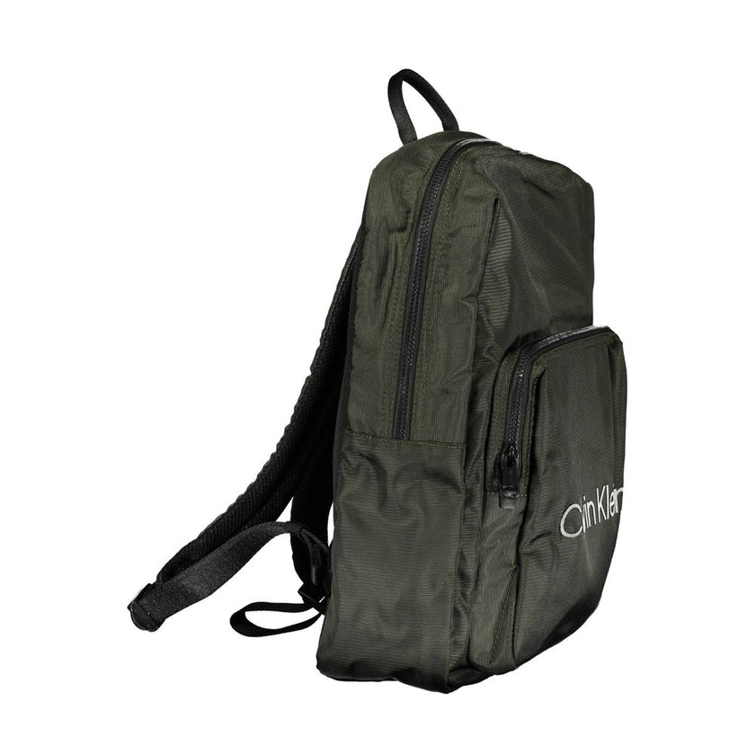 Green Polyester Men BackpackStep into the urban jungle with Calvin Klein’s sleek backpack, crafted for the modern voyager. Merging style with functionality, this green accessory boasts an external pocket for easy access, an internal laptop space to keep y