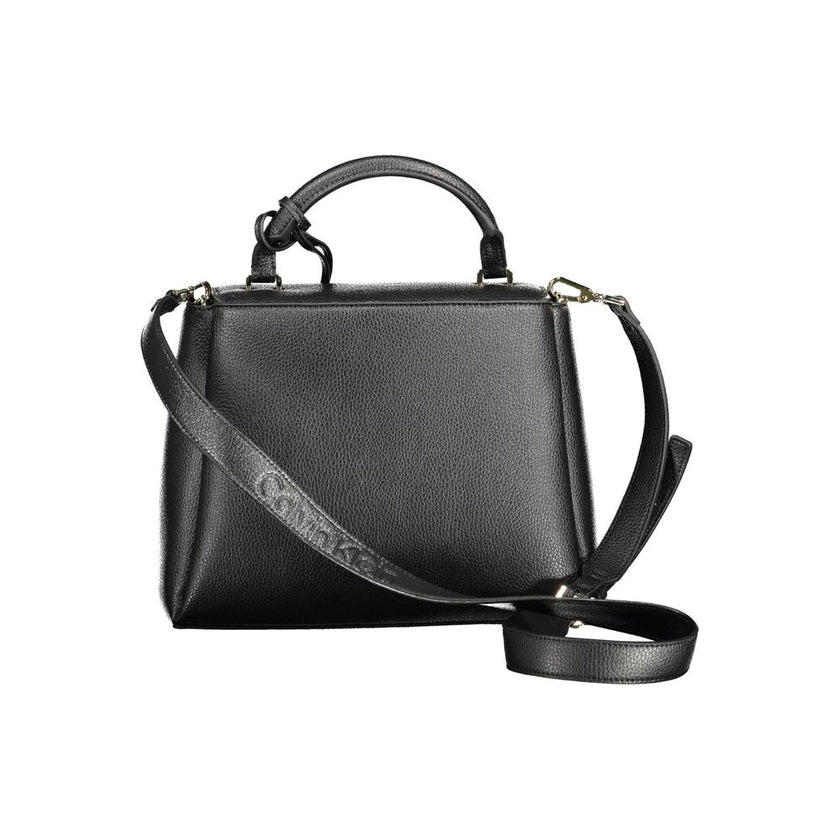 Black Polyester Women HandbagStep into the vanguard of fashion with the Calvin Klein handbag, expertly designed to encapsulate both functionality and elegance. This sophisticated accessory is a testament to the mindful fashionista, boasting 100% recycled