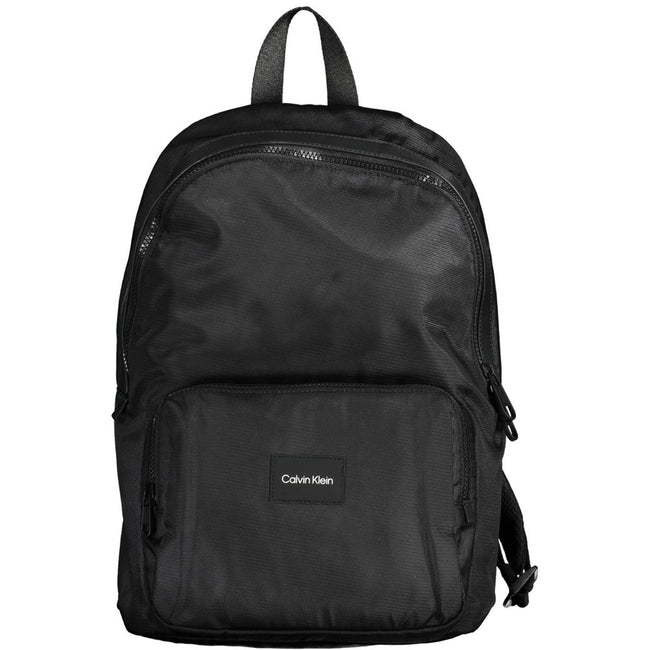 Black Polyester Men BackpackElevate your style with the sleek and sophisticated Calvin Klein backpack. Crafted for the urban trendsetter, this backpack stands out with its bold logo and contemporary design. With adjustable straps and a range of pockets, i