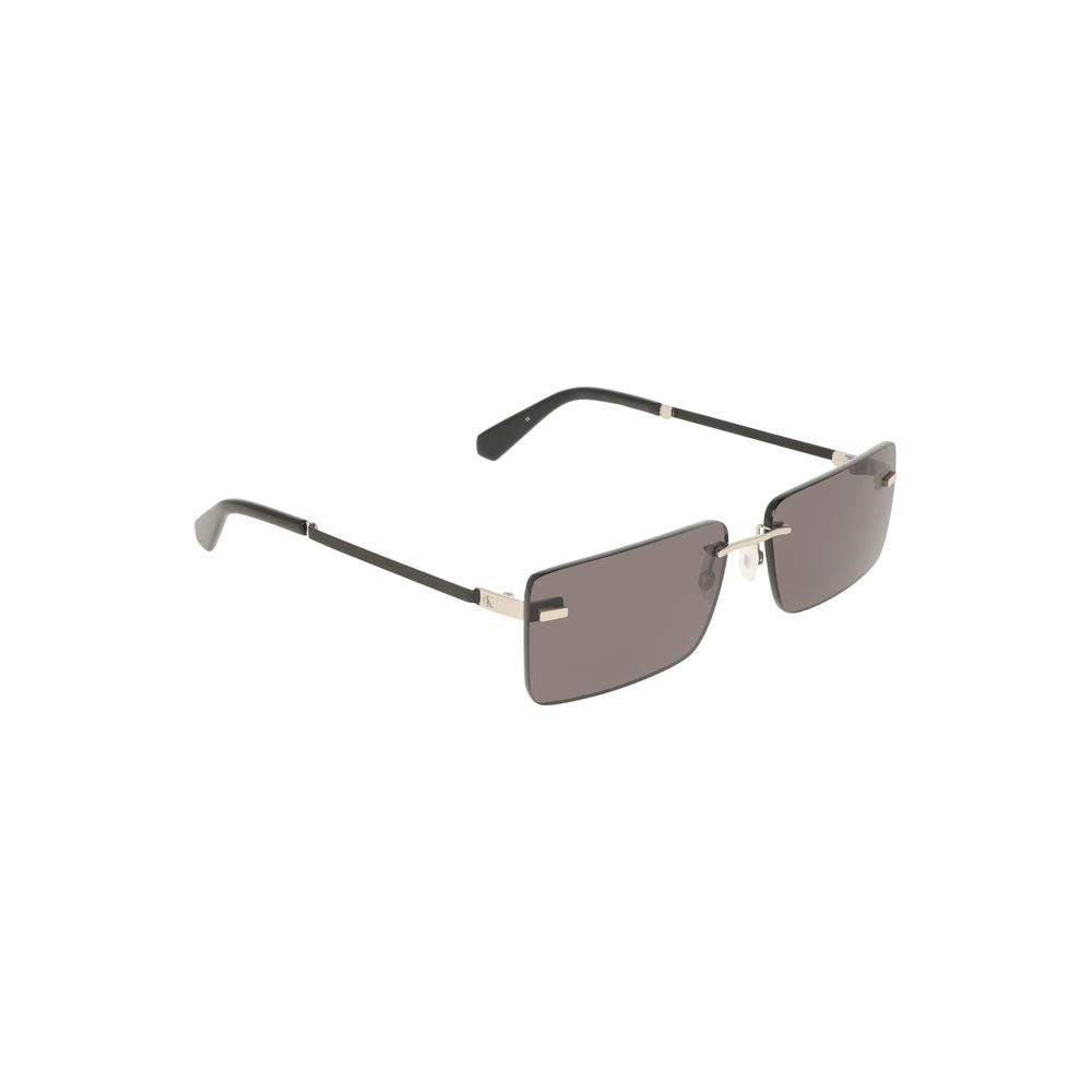 Black Metal Women SunglassElevate your eyewear game with these sleek Calvin Klein sunglasses. With their sophisticated metal frame and smoldering smoke lens, they perfectly blend modern edginess with timeless elegance. Feel the luxury that complements eve