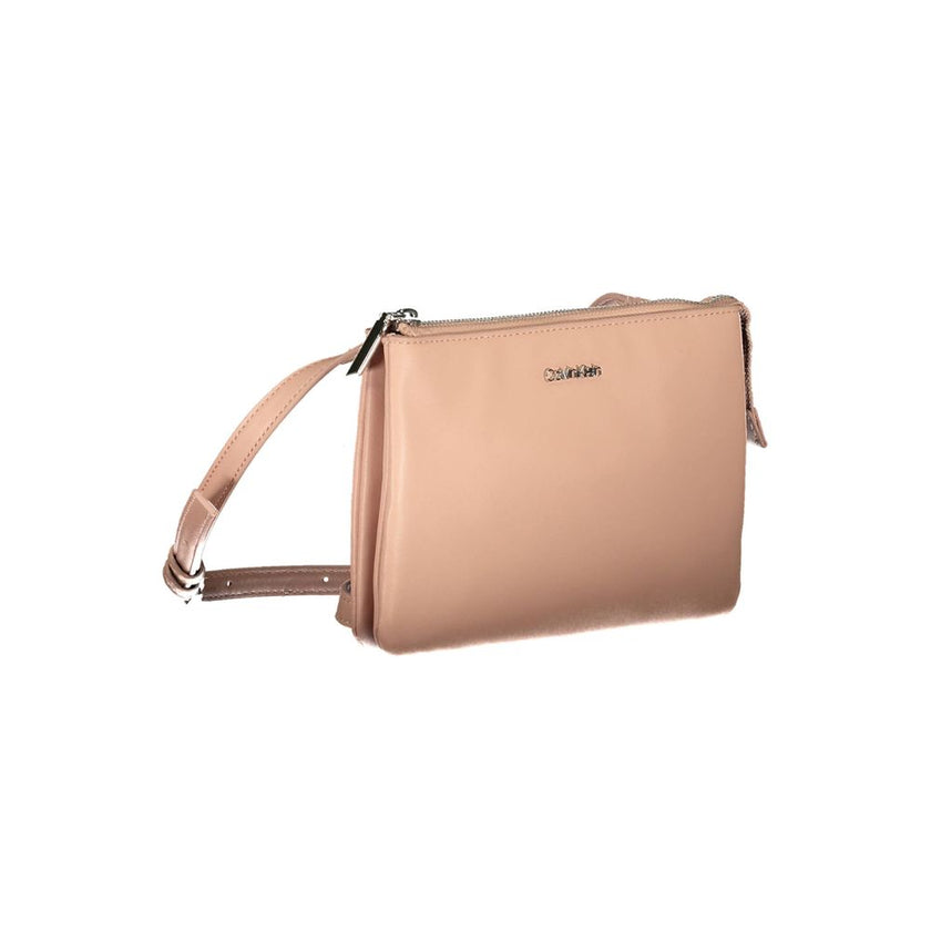 Pink Polyester Women HandbagDare to stand out with this sleek Calvin Klein handbag, a true testament to eco-chic fashion. Featuring a bold pink hue that makes a statement, this bag is designed with practicality in mind, offering two compartments and an in