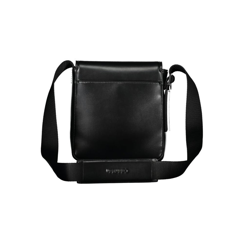 Sleek Black Shoulder Bag with Logo DetailElevate your everyday style with this sleek and functional shoulder bag by Calvin Klein. Crafted with a blend of polyester and polyethylene for durability, it features an adjustable shoulder strap for personalized