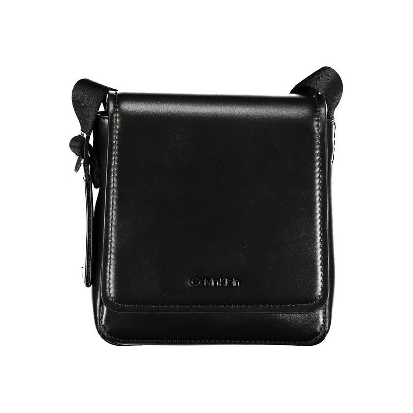 Sleek Black Shoulder Bag with Logo DetailElevate your everyday style with this sleek and functional shoulder bag by Calvin Klein. Crafted with a blend of polyester and polyethylene for durability, it features an adjustable shoulder strap for personalized