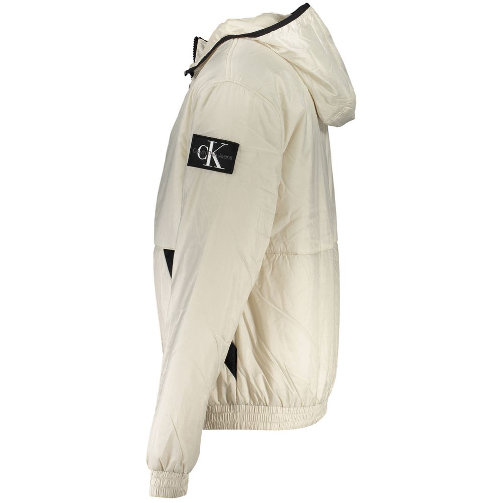 Beige Polyester Men JacketExperience eco-conscious luxury with this Calvin Klein hooded jacket, a perfect blend of sustainability and style. Crafted from 100% recycled polyester, it’s designed to make a statement while keeping you warm with a lightweight