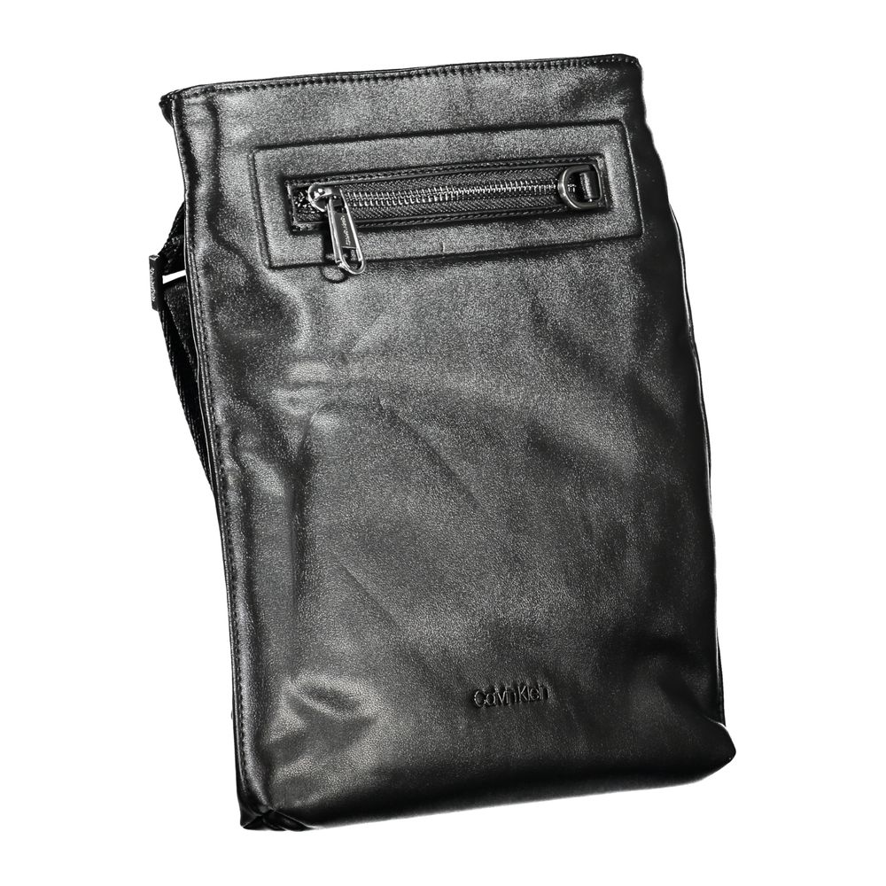 Sleek Black Shoulder Bag with Contrast DetailsDiscover functional elegance with this Calvin Klein shoulder bag, perfect for the modern man on the go. Crafted with sustainability in mind, featuring 50% recycled polyester, this accessory does not compromise