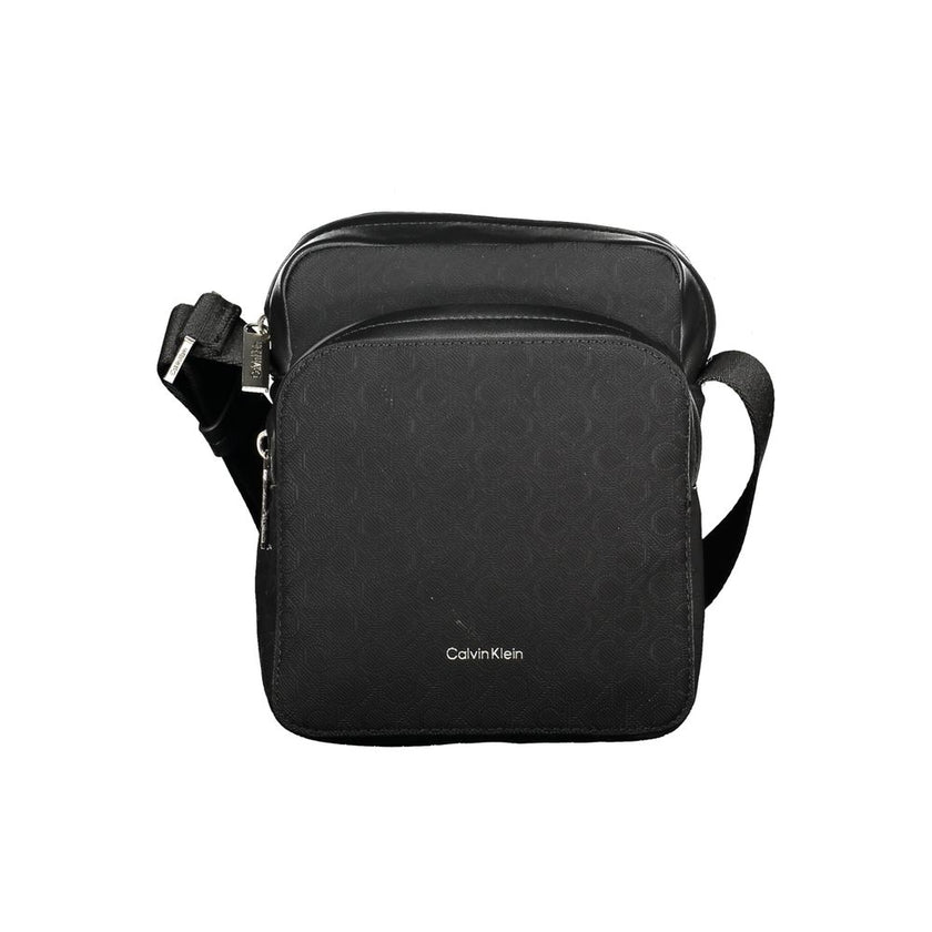 Black Polyester Men Shoulder BagElevate your accessory game with the sleek Calvin Klein shoulder bag, where functionality meets refined style. This bag is designed for the modern man on-the-go, featuring a durable build with a sharp black finish that comm
