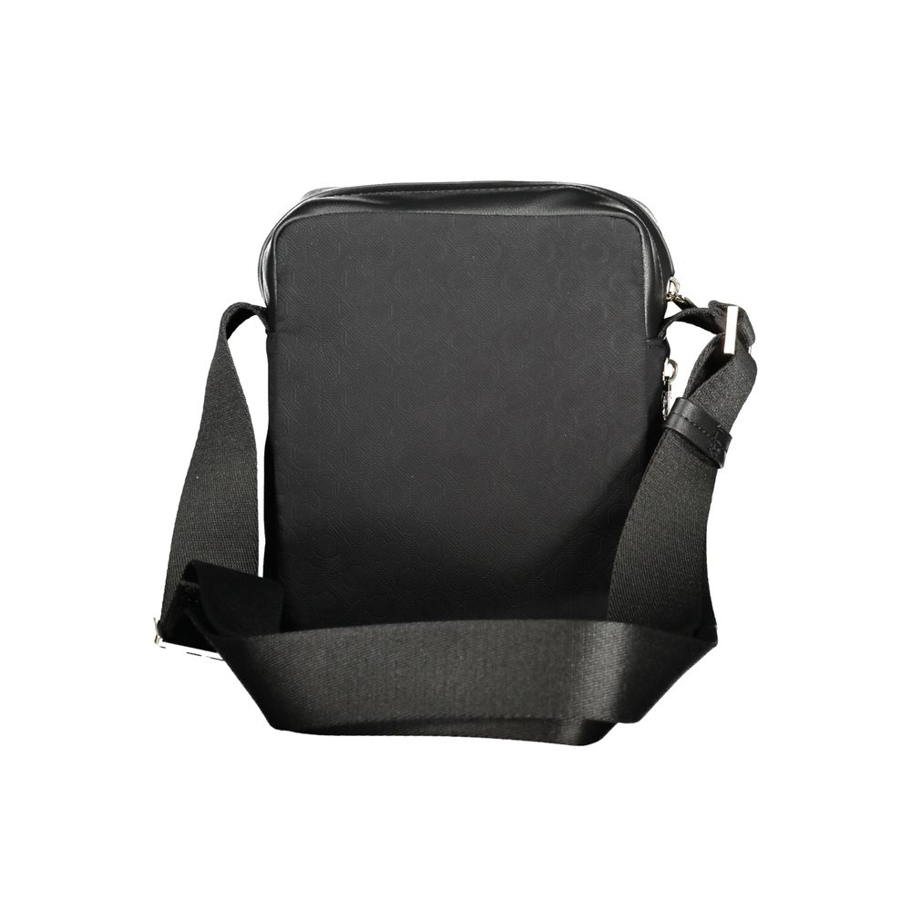 Black Polyester Men Shoulder BagElevate your accessory game with the sleek Calvin Klein shoulder bag, where functionality meets refined style. This bag is designed for the modern man on-the-go, featuring a durable build with a sharp black finish that comm