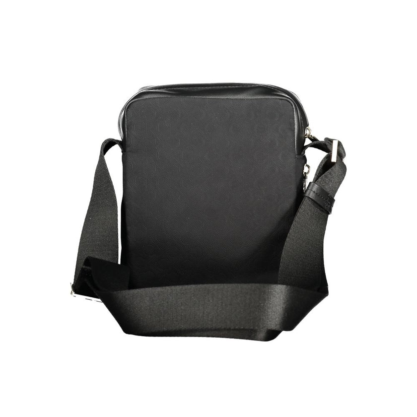 Black Polyester Men Shoulder BagElevate your accessory game with the sleek Calvin Klein shoulder bag, where functionality meets refined style. This bag is designed for the modern man on-the-go, featuring a durable build with a sharp black finish that comm