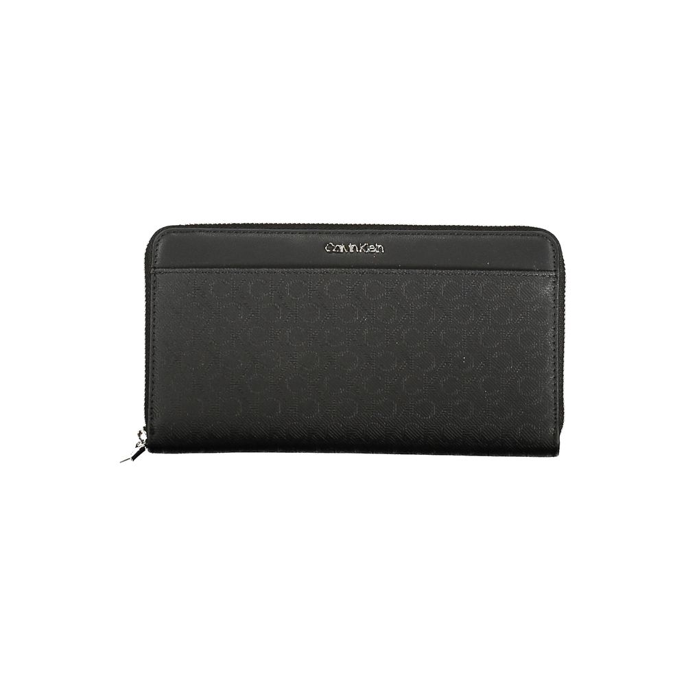 Black Polyester Women WalletElevate your everyday essentials with the Calvin Klein sophistication in this sleek wallet. Designed for the modern trendsetter, this wallet offers a dual-compartment design that is both elegant and practical. An external pocke