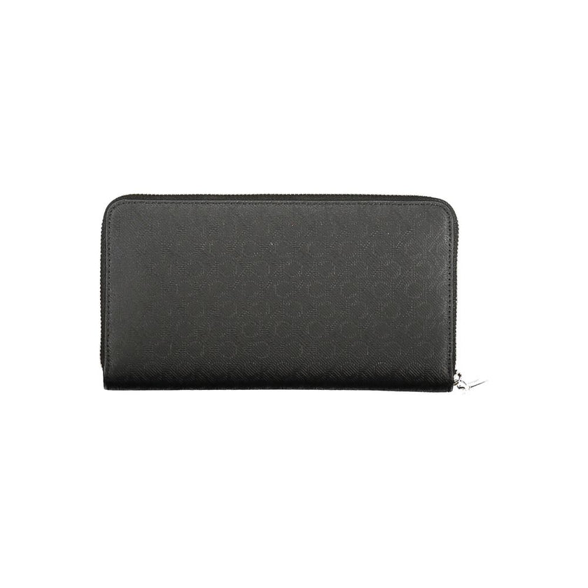 Black Polyester Women WalletElevate your everyday essentials with the Calvin Klein sophistication in this sleek wallet. Designed for the modern trendsetter, this wallet offers a dual-compartment design that is both elegant and practical. An external pocke