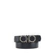 Black Calf Leather Bos Taurus Regular BeltFerragamo’s Reversible leather Belt features a double-face design that allows you to choose between two different looks. The metal buckle is embellished with the brand’s iconic Gancini logo, with the Ferragamo sig