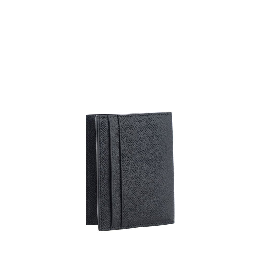 Black Calf Leather Bos Taurus WalletThe Ferragamo Revival leather Card Holder is crafted from premium leather and finished with a sophisticated metal plaque with the iconic logo applique on the front. The billfold style offers a slim yet functional struct
