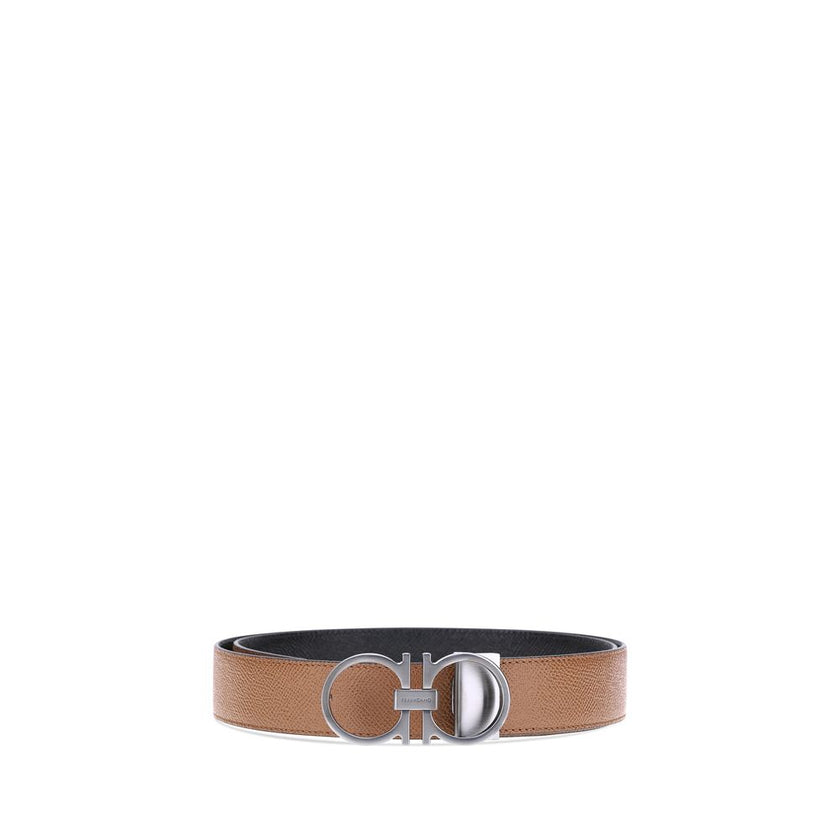 Brown Calf Leather Bos Taurus Regular BeltFerragamo’s Gancini reversible leather Belt features a three-dimensional buckle with the brand’s iconic Gancini logo. The reversible monochrome grained leather design offers two style options, making it versatile