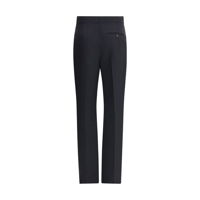 Black Viscose Casual PantsFerragamo’s tailored Pants exemplify elegance and handcrafted perfection. Featuring a straight front pleat pattern, these pants offer a refined silhouette and an impeccable fit. The front zip-and-hook closure ensures a secure and