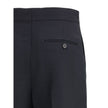 Black Viscose Casual PantsFerragamo’s tailored Pants exemplify elegance and handcrafted perfection. Featuring a straight front pleat pattern, these pants offer a refined silhouette and an impeccable fit. The front zip-and-hook closure ensures a secure and