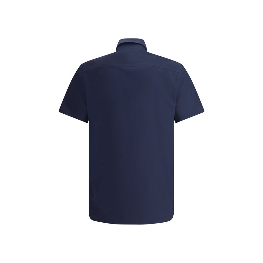 Blue Cotton Shortsleeve ShirtBurberry’s Short Sleeve Shirt combines essential elegance with iconic details. Featuring a classic collar and front button closure, it is distinguished by the iconic Equestrian Knight logo sewn on the front, which adds a touch