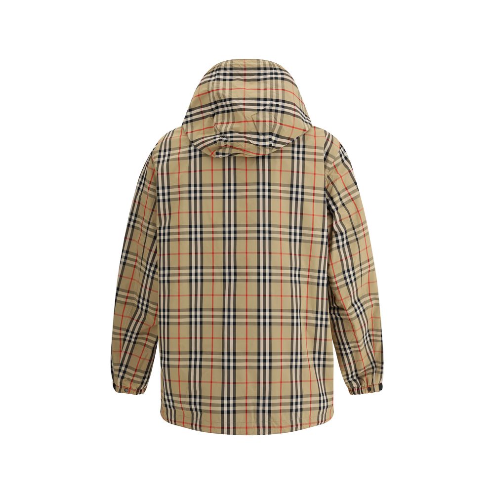 Multicolor Polyamide Rain CoatBurberry’s reversible Waterproof Jacket combines functionality and iconic style in a practical, modern design. Featuring an adjustable drawstring hood, it features a double-slider front zipper closure, elastic cuffs and two s