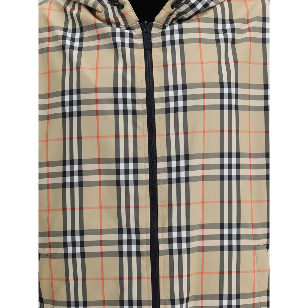 Multicolor Polyester Shell JacketThe Archive Check reversible Jacket by Burberry is a versatile and stylish garment that offers two looks in one. On one side, it sports the brand’s iconic check pattern, while on the other it features a solid-color design