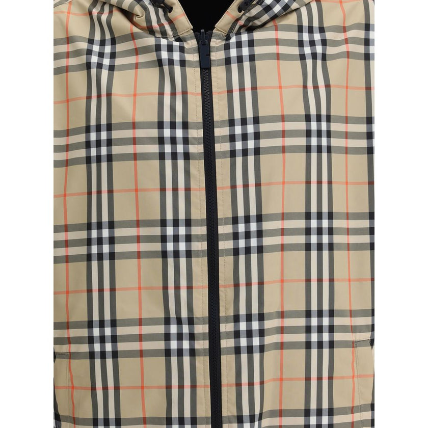 Multicolor Polyester Shell JacketThe Archive Check reversible Jacket by Burberry is a versatile and stylish garment that offers two looks in one. On one side, it sports the brand’s iconic check pattern, while on the other it features a solid-color design