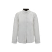 White Cotton Dress ShirtBurberry’s Cotton Shirt revisits a wardrobe classic with discreet nods to the brand’s heritage. The essential design with a classic collar, front placket and button cuffs is enhanced by patterned Archivio Check details cleverly tuc