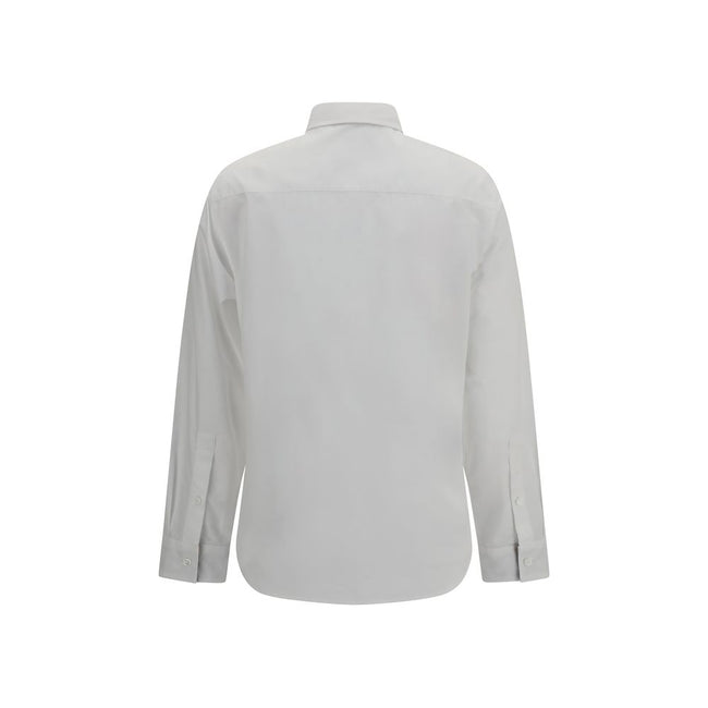 White Cotton Dress ShirtBurberry’s Cotton Shirt revisits a wardrobe classic with discreet nods to the brand’s heritage. The essential design with a classic collar, front placket and button cuffs is enhanced by patterned Archivio Check details cleverly tuc