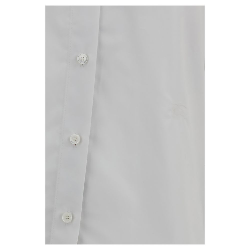 White Cotton Dress ShirtBurberry’s Cotton Shirt revisits a wardrobe classic with discreet nods to the brand’s heritage. The essential design with a classic collar, front placket and button cuffs is enhanced by patterned Archivio Check details cleverly tuc
