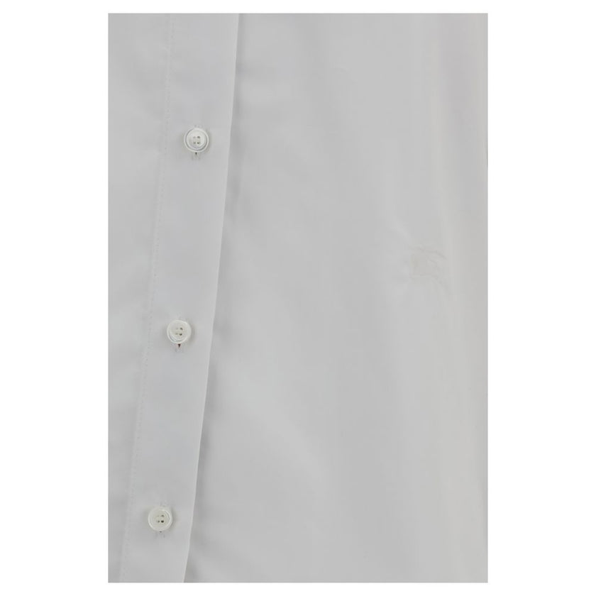 White Cotton Dress ShirtBurberry’s Cotton Shirt revisits a wardrobe classic with discreet nods to the brand’s heritage. The essential design with a classic collar, front placket and button cuffs is enhanced by patterned Archivio Check details cleverly tuc