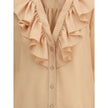 Ruffle ShirtChloé’s Habotai Silk Ruffle Shirt by Chloé is a romantic and sophisticated piece, perfect for adding an ethereal touch to your wardrobe. Featuring a V-neckline and a delicate row of ruffles on the front, it expresses femininity with lightness