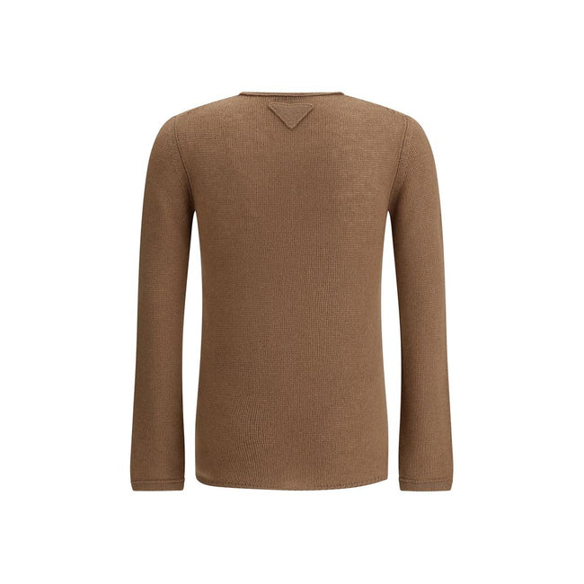Brown Cashmere Cashmere SweaterPrada’s monochrome cashmere crew neck Sweater is an iconic garment that combines elegance and comfort. Crafted from high-quality pure cashmere, it features a refined knit design with monochrome workmanship, perfect for those