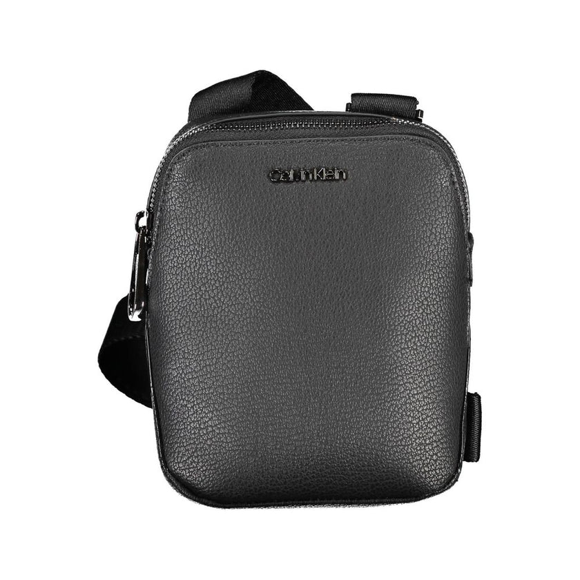 Sleek Black Shoulder Bag with Logo DetailDiscover the perfect blend of style and practicality with this sleek black shoulder bag, designed for the modern individual on the go. Featuring an adjustable shoulder strap for customized comfort, a handy external