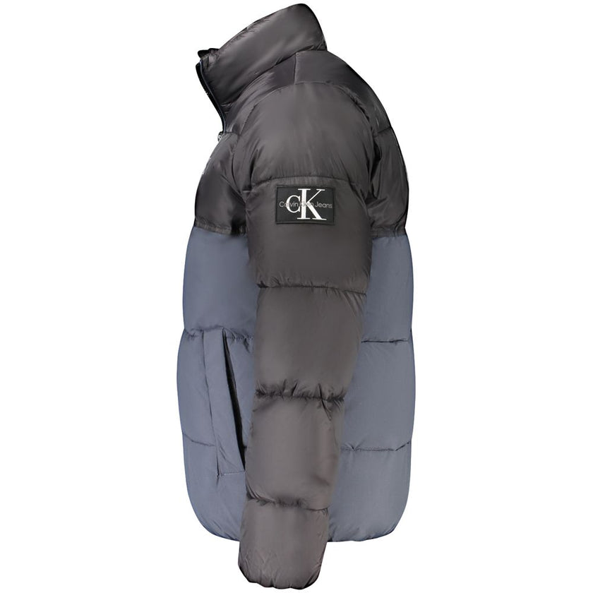 Blue Polyester Men JacketElevate your outerwear with the eco-conscious flair of Calvin Klein’s tailored jacket, redefining style with a sustainable edge. This long sleeve masterpiece comes adorned with contrasting black details, a dynamic print, and the i