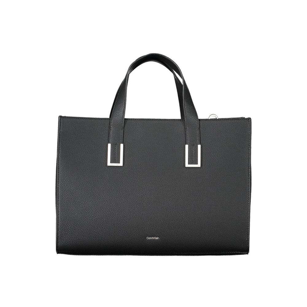 Black Polyester Women HandbagElevate your accessory game with this Calvin Klein masterpiece, where eco-conscious luxury meets functional elegance. This black handbag boasts a sophisticated design with two handles, an adjustable and removable shoulder stra