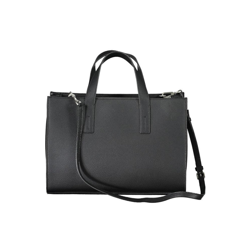 Black Polyester Women HandbagElevate your accessory game with this Calvin Klein masterpiece, where eco-conscious luxury meets functional elegance. This black handbag boasts a sophisticated design with two handles, an adjustable and removable shoulder stra