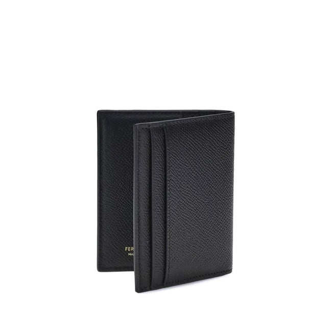 Black Calf Leather Bos Taurus WalletFerragamo’s Leather Card Holder combines functionality and elegance in a compact design. Featuring 8 internal and 2 external slots, it offers generous capacity ideal for the dynamic man. The Gancini ornament on the fron