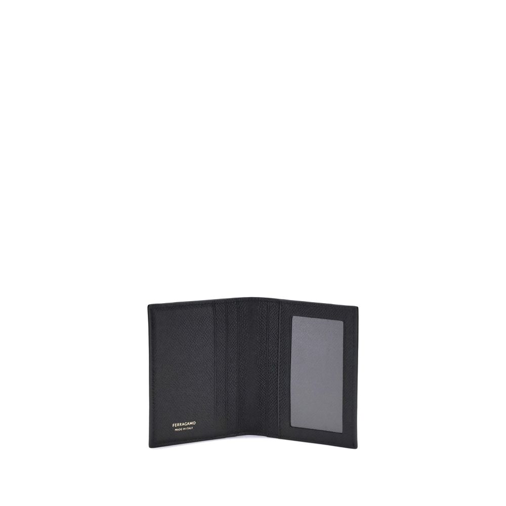 Black Calf Leather Bos Taurus WalletFerragamo’s Leather Card Holder combines functionality and elegance in a compact design. Featuring 8 internal and 2 external slots, it offers generous capacity ideal for the dynamic man. The Gancini ornament on the fron